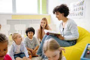 Teacher outfit reading A Book To The Children