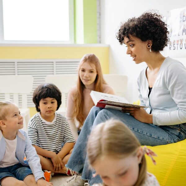 Teacher outfit reading A Book To The Children