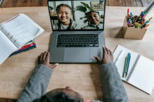 Black teacher using laptop teacher strategy