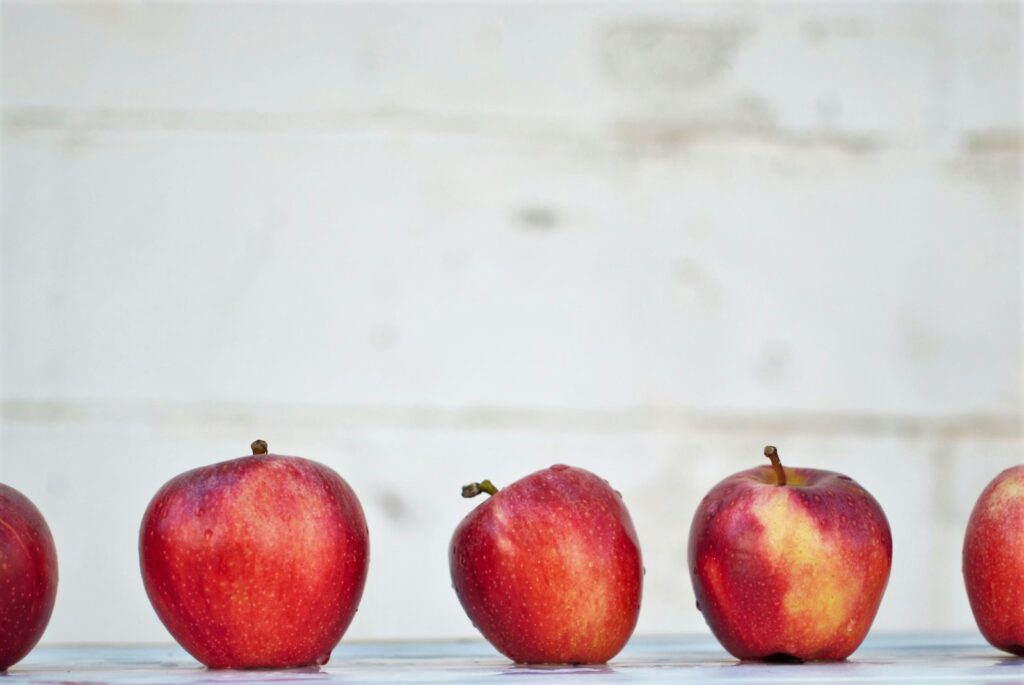 five red apples on white surface teacher strategies