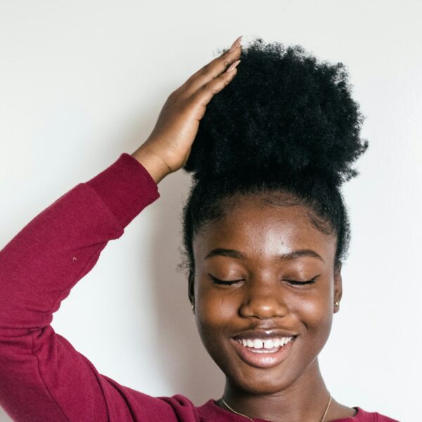 woman touching her hair