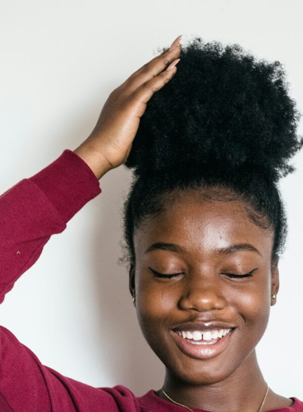 woman touching her hair