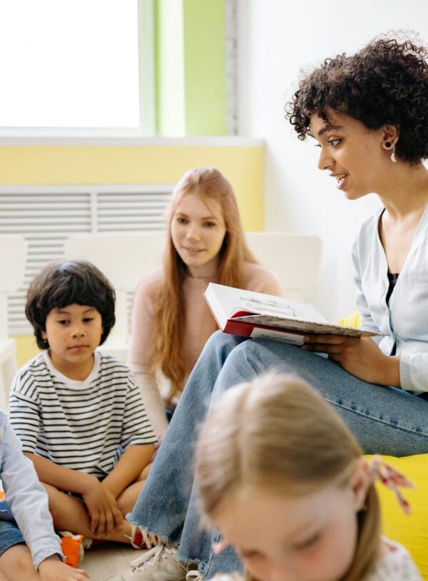 Teacher outfit reading A Book To The Children